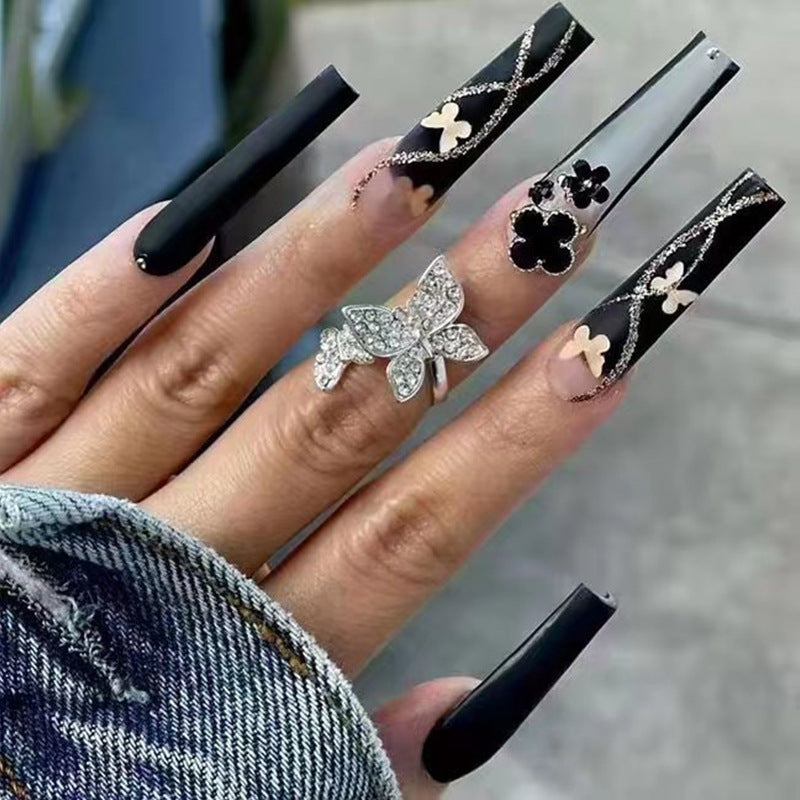 Art nail set with elegant butterfly and flower motifs Stornfield