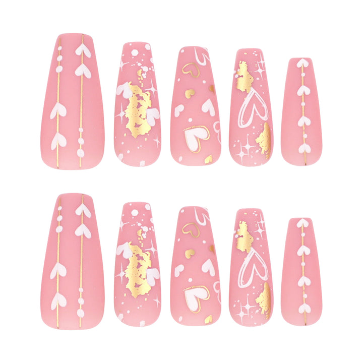Artificial nail art with heart and glitter designs Stornfield