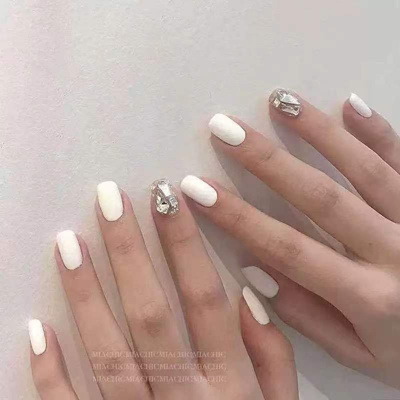 Artificial nails with glitter design and elegant accents Stornfield