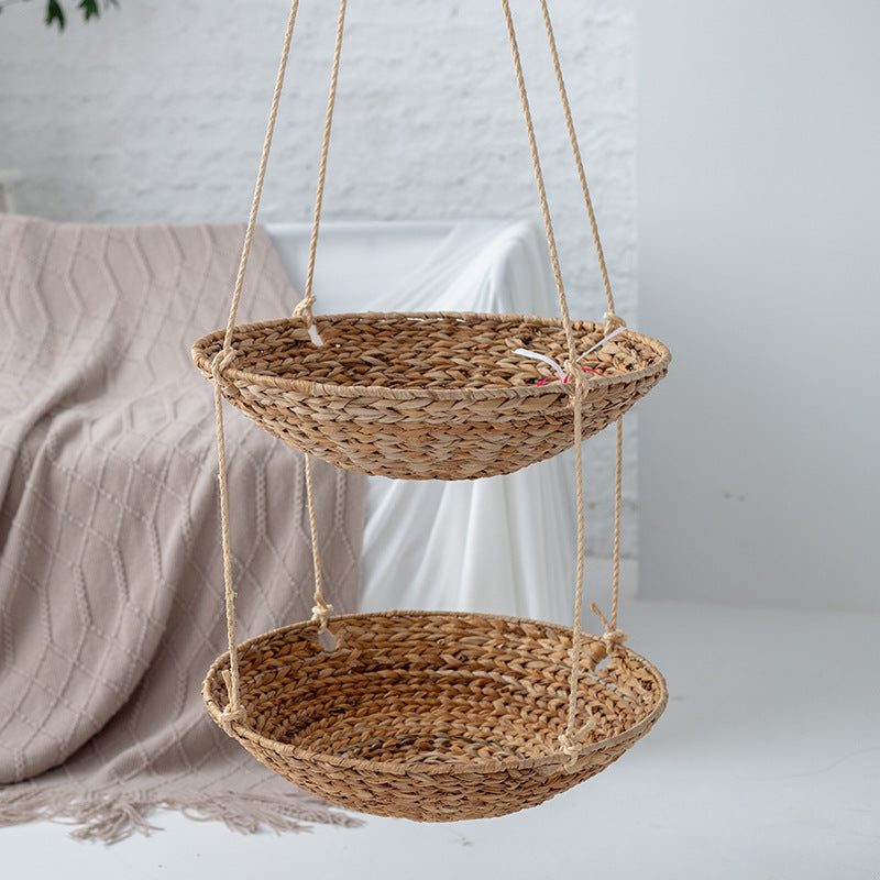 Hanging chair made of braided natural material with comfortable cushions Stornfield