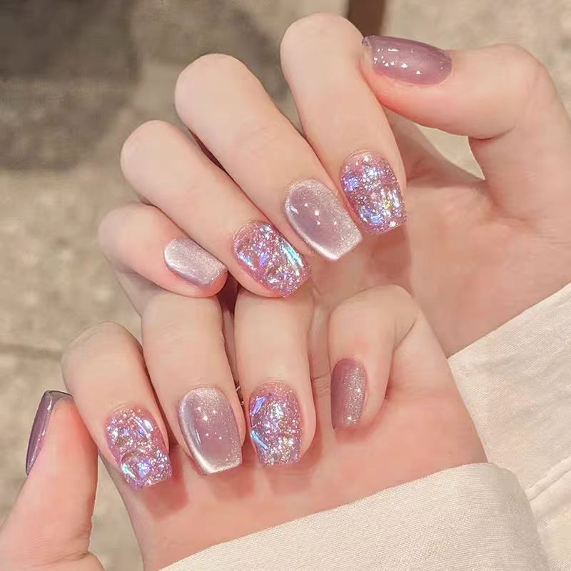 Acrylic nails with glitter accents and modern designs Stornfield