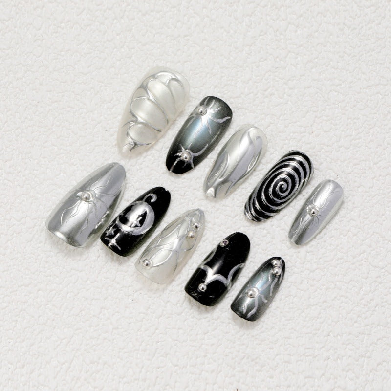 Artificial nails with metallic effects and complex designs Stornfield