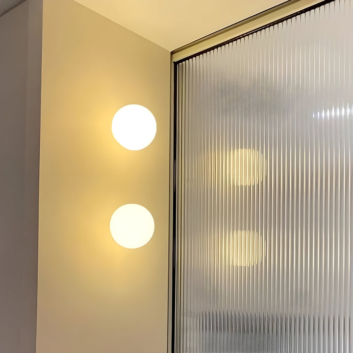 GlasAura Wall Lamp with Matte Glass Ball and Metal Base | Stornfield