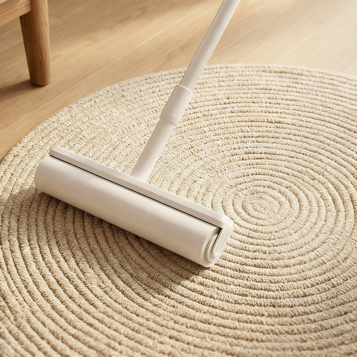 Lint roller with extendable handle