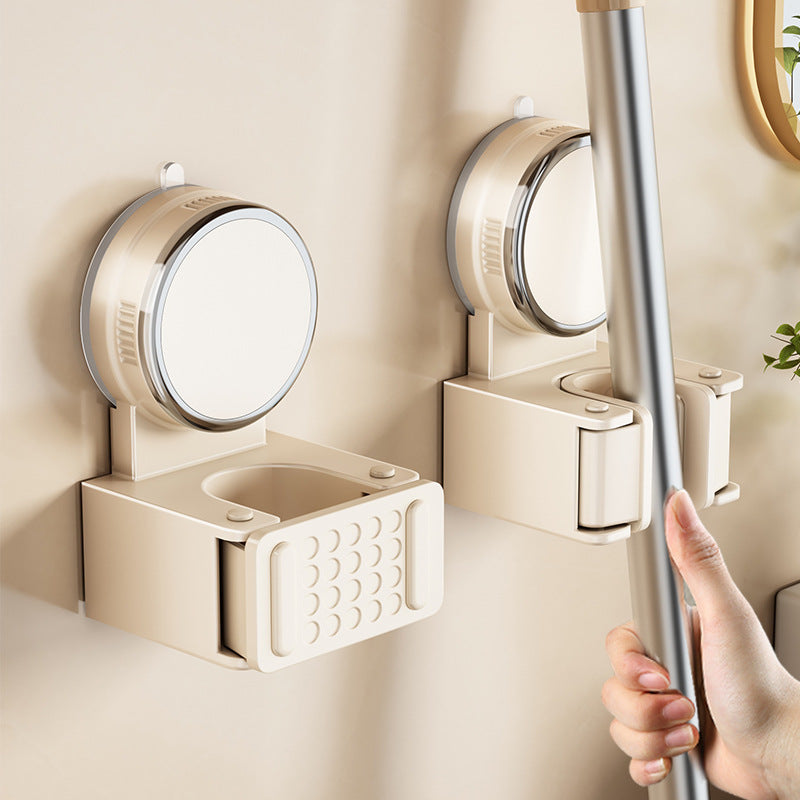 Suction cup holder for mop and broom