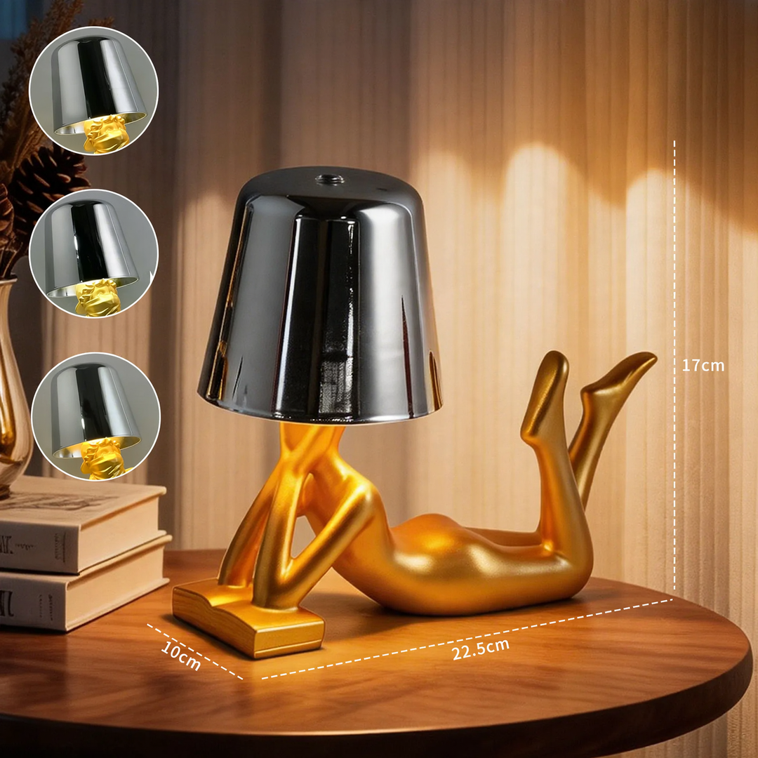 Modern table lamp with reclining figure shape