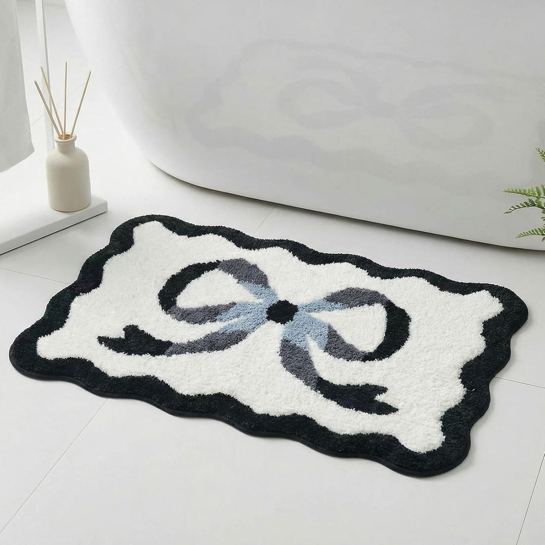 Bath mat with bow motif, synthetic fiber fabric