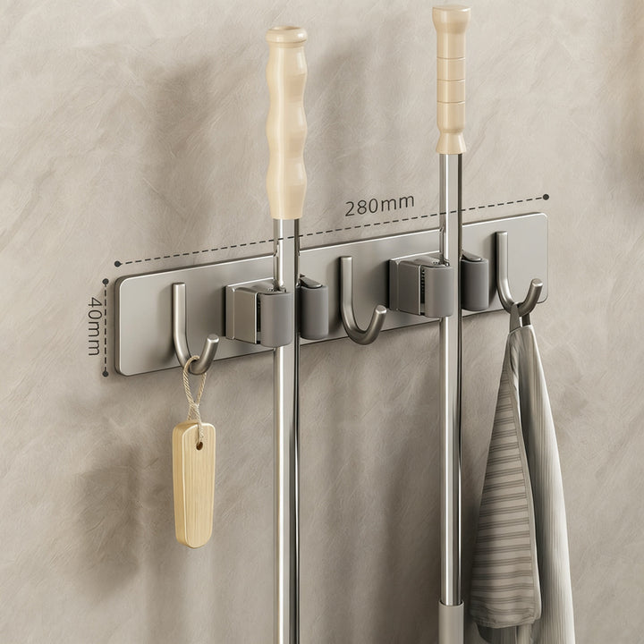Wall bracket for brooms and mops made of stainless steel