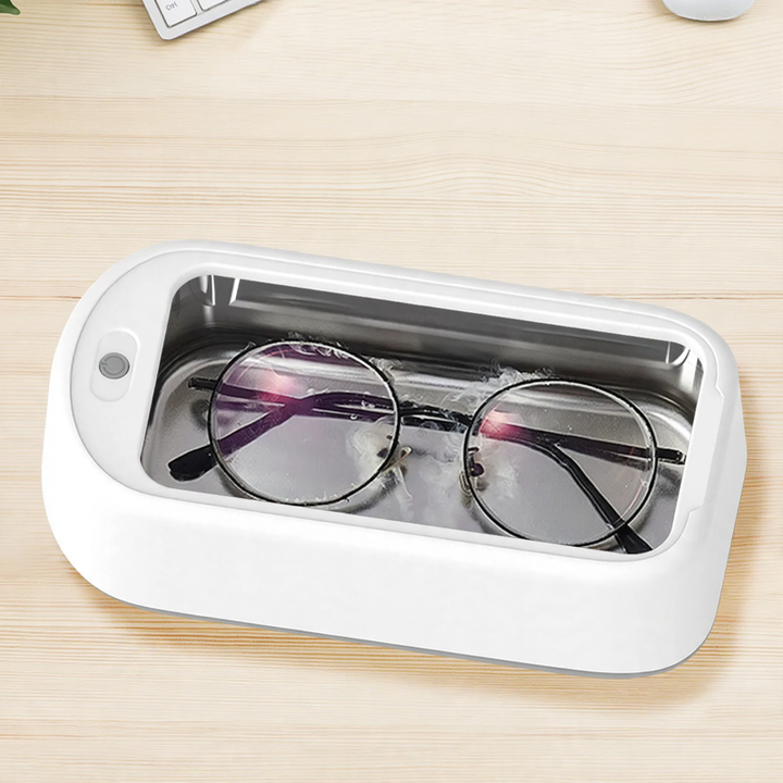 Ultrasonic eyewear cleaner with stainless steel