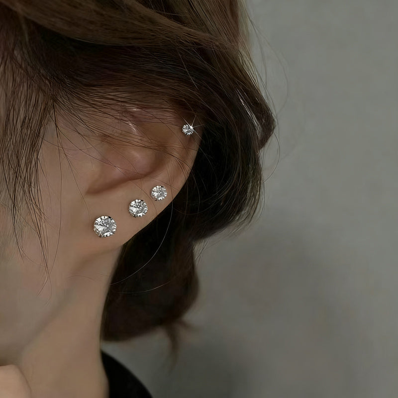 Titanium alloy earrings with zirconia, screw closure
