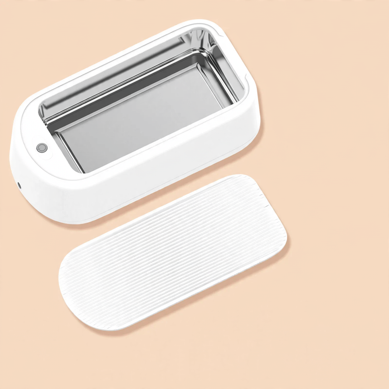 Ultrasonic eyewear cleaner with stainless steel