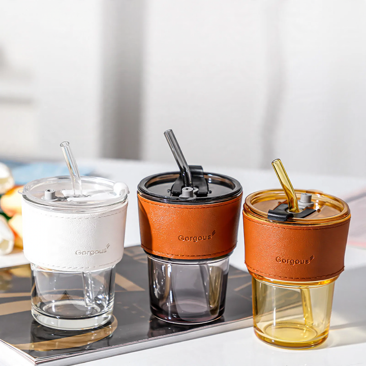 Glass drinking cup with straw