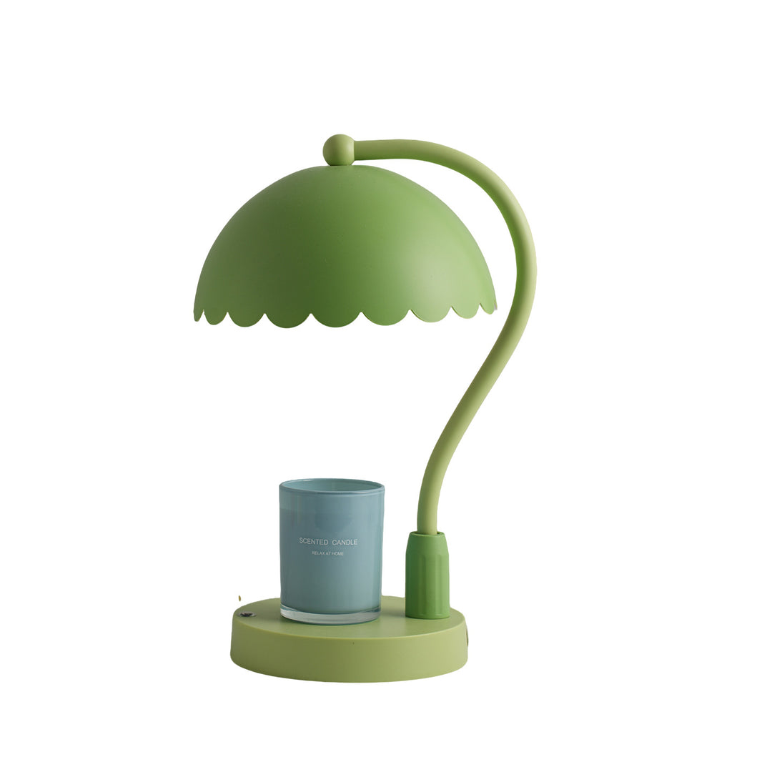 Table lamp with scented candle and lever mechanism