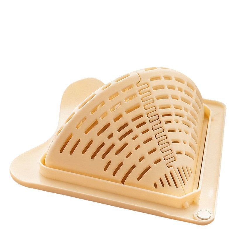 Kitchen sieve with magnetic attachment for the sink