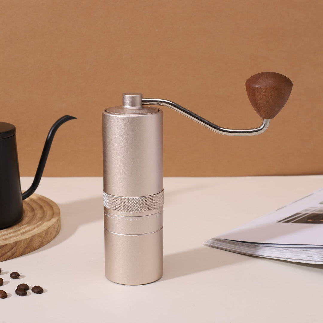 Hand coffee grinder with CNC grinding mechanism and brush