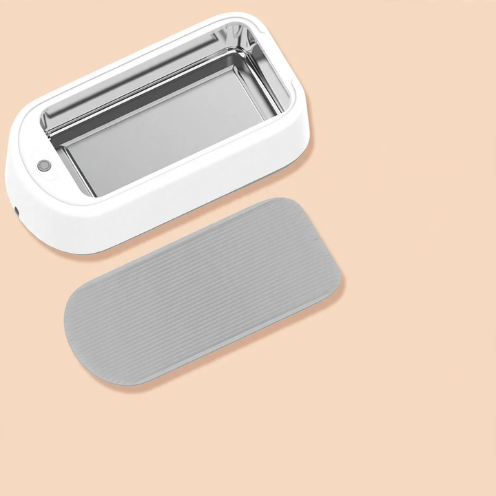 Ultrasonic eyewear cleaner with stainless steel