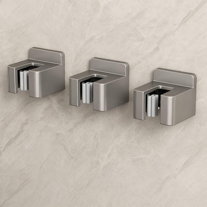 Stainless steel wall holder for brooms and mops