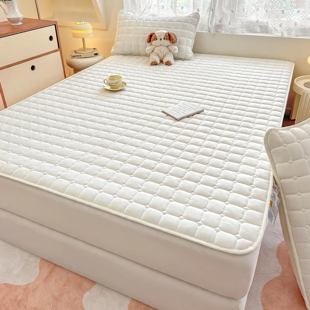Waterproof mattress pad with quilting