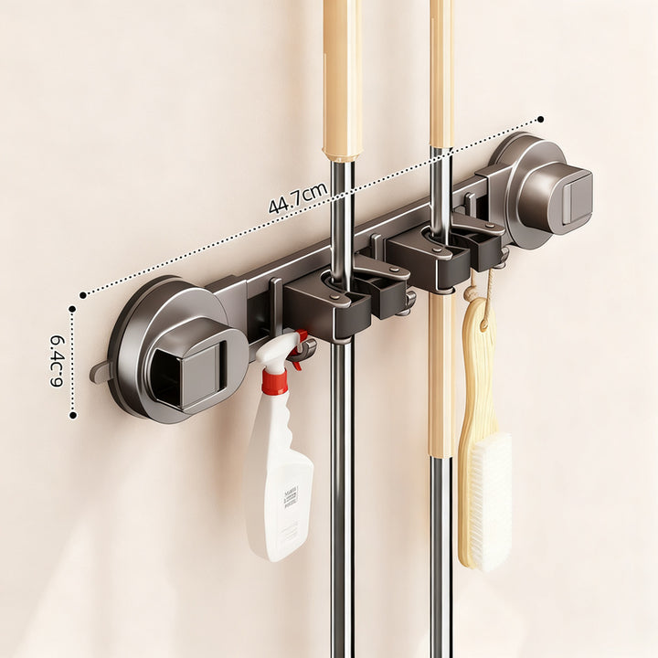Suction cup holder for brooms and cleaning tools