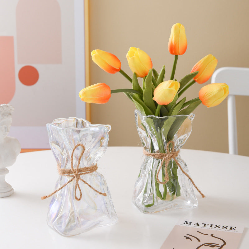 Glass vase with irregular folding pattern