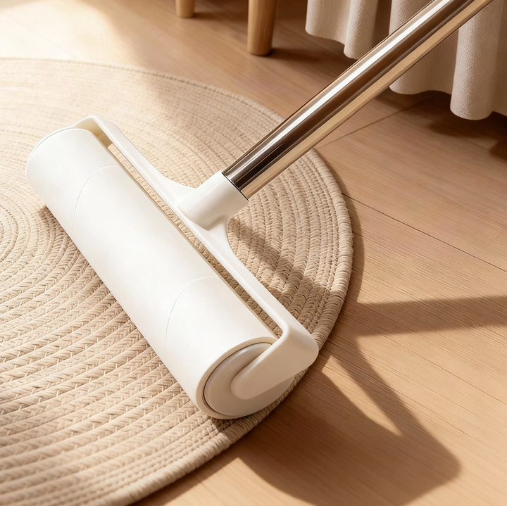 Lint roller with extendable handle