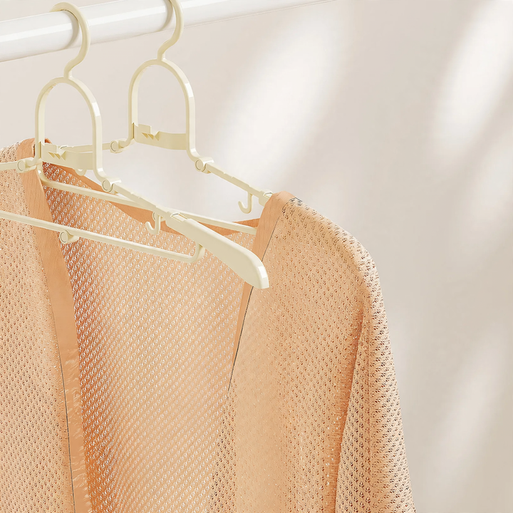 Foldable clothes hanger, portable and space-saving