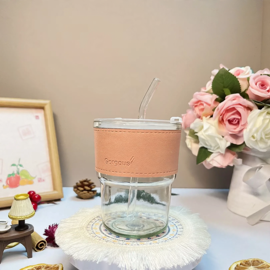 Glass drinking cup with straw