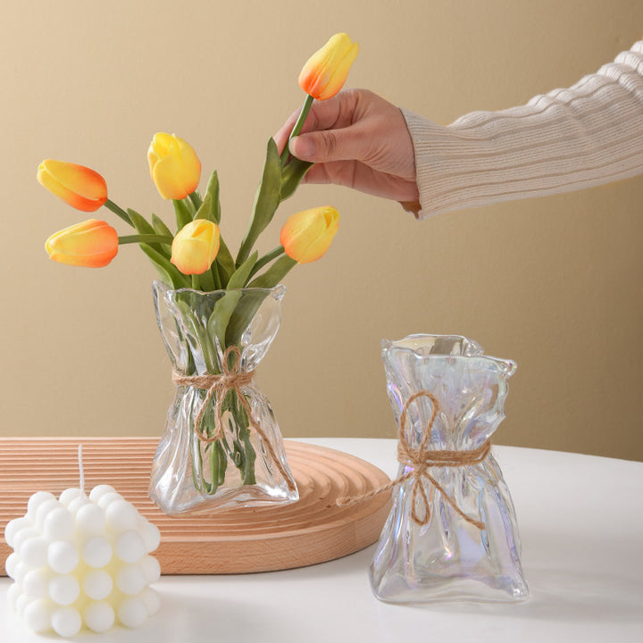 Glass vase with irregular folding pattern