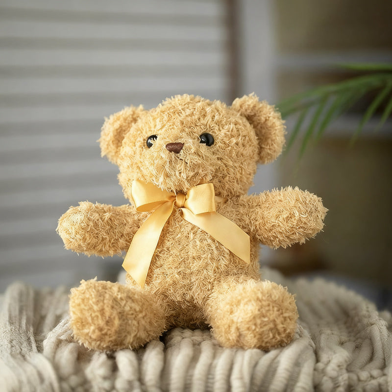 Plush teddy bear with bow, 25–30 cm