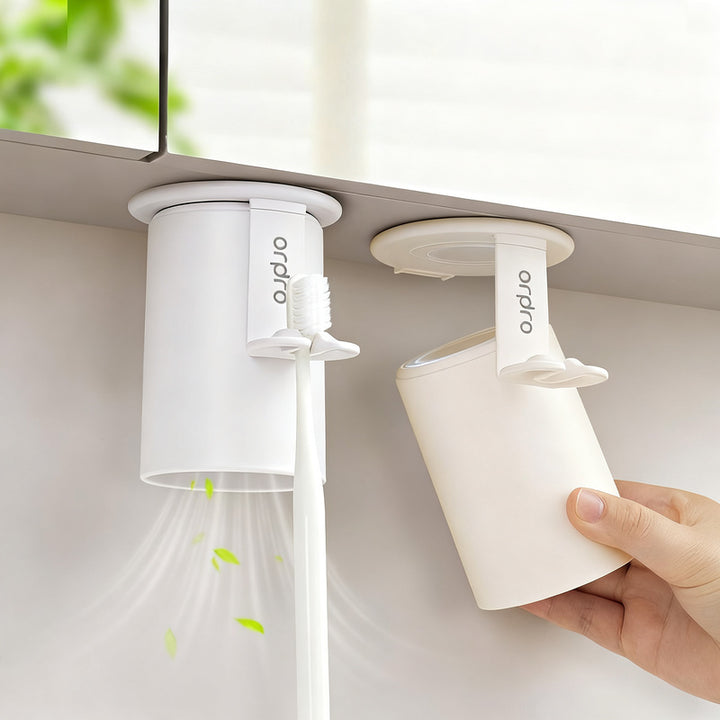 Magnetic toothbrush and rinse cup holder