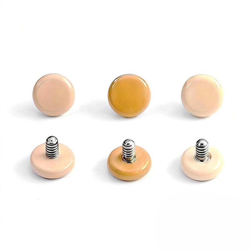 Titanium alloy earrings with zirconia, screw closure