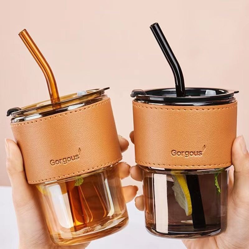 Glass drinking cup with straw