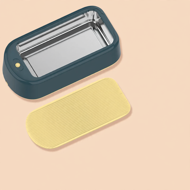 Ultrasonic eyewear cleaner with stainless steel