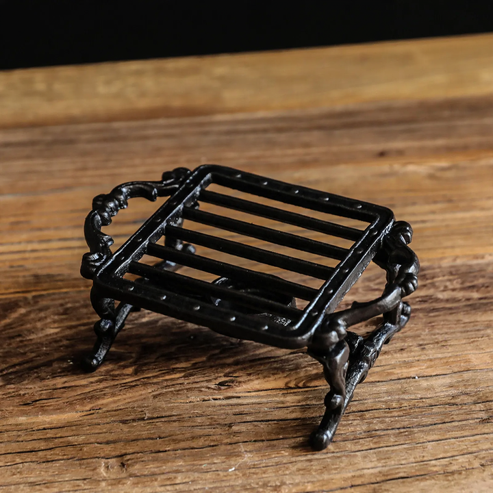 Cast iron tea warmer with burner stand