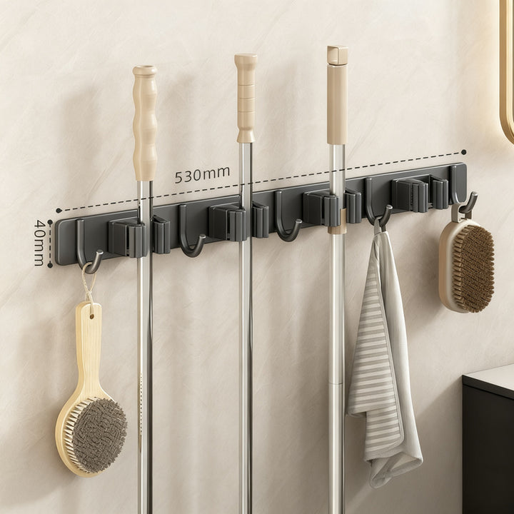 Wall bracket for brooms and mops made of stainless steel
