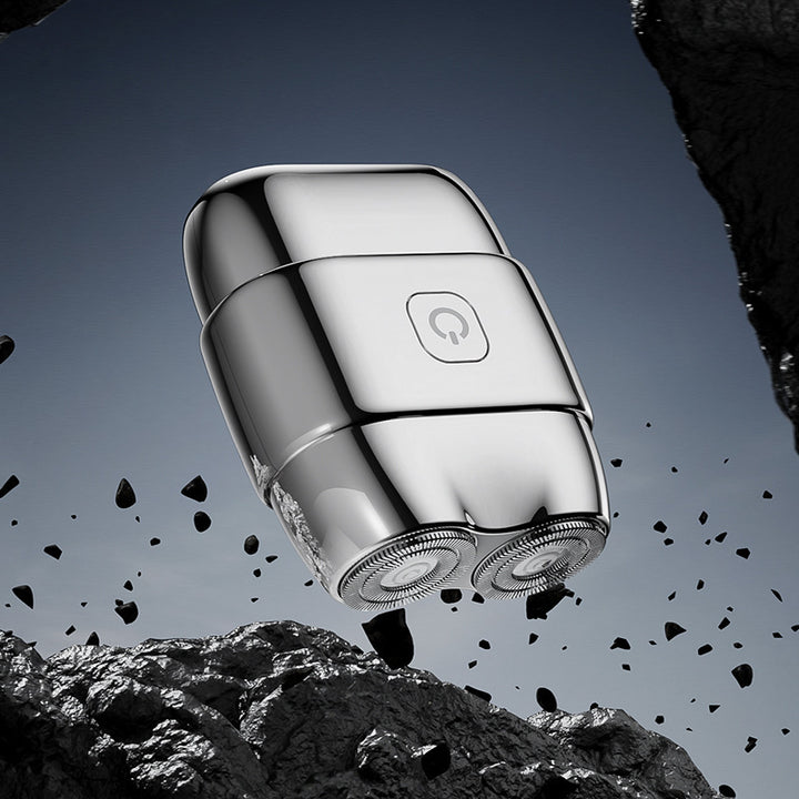 Portable electric razor with double blade ring