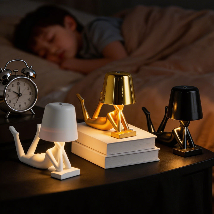 Modern table lamp with reclining figure shape