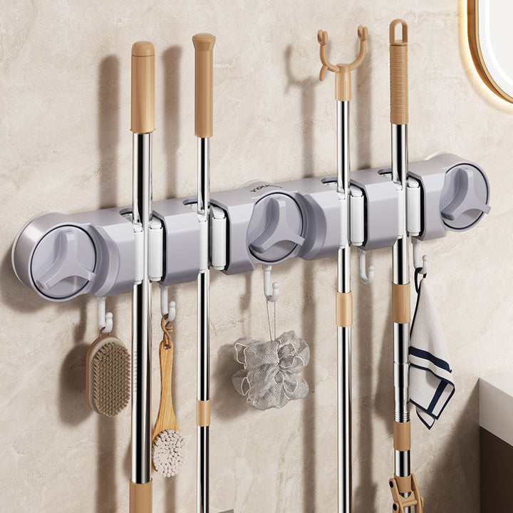 Suction cup holder for broom and mop