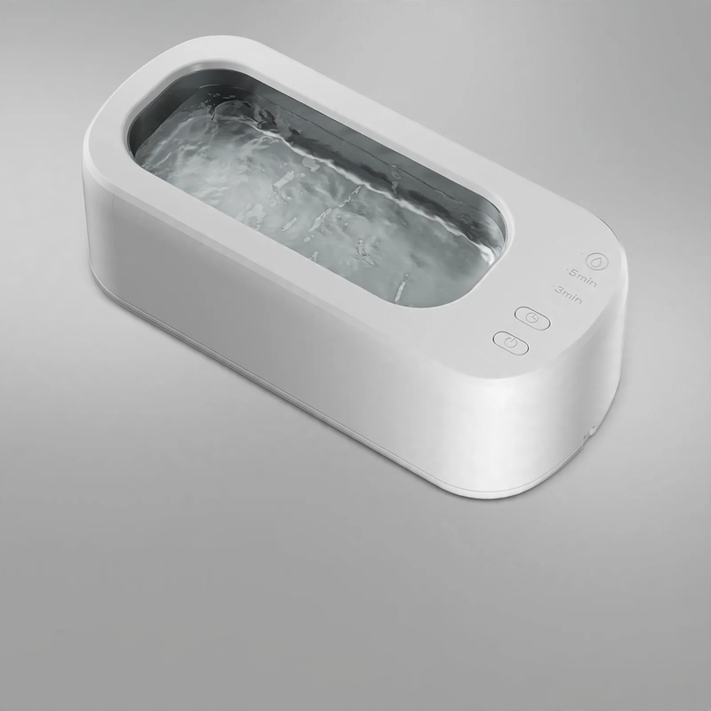 Double chamber ultrasonic cleaning device