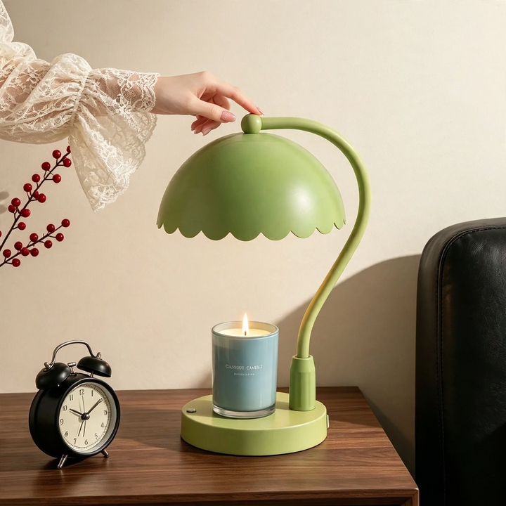 Table lamp with scented candle and lever mechanism
