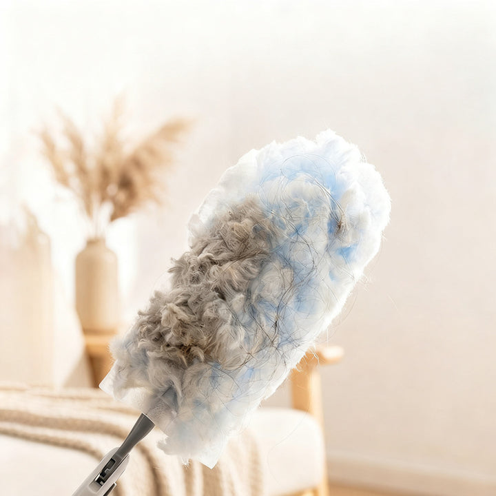 Telescopic dust duster with interchangeable brushes