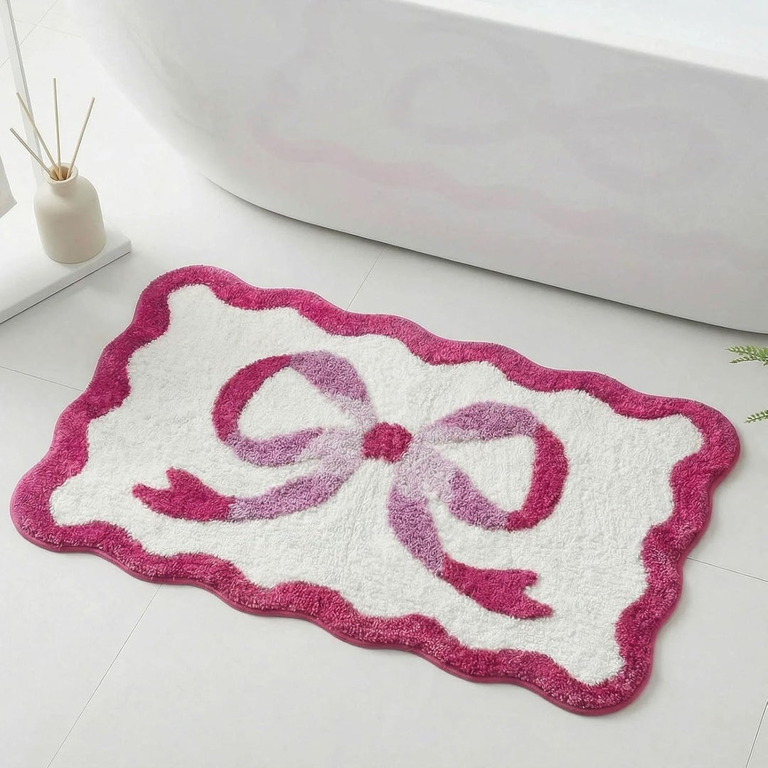 Bath mat with bow motif, synthetic fiber fabric