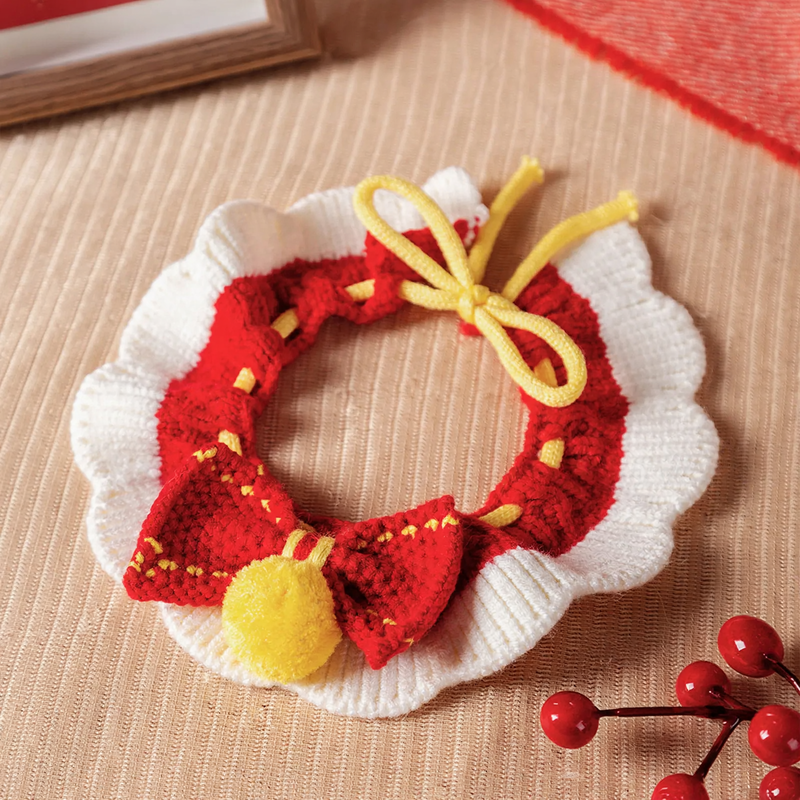 Knitted pet bandana with festive patterns