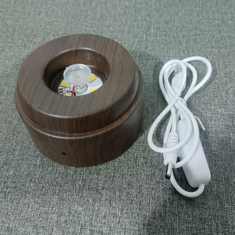 Glowing crystal ball with rotating base