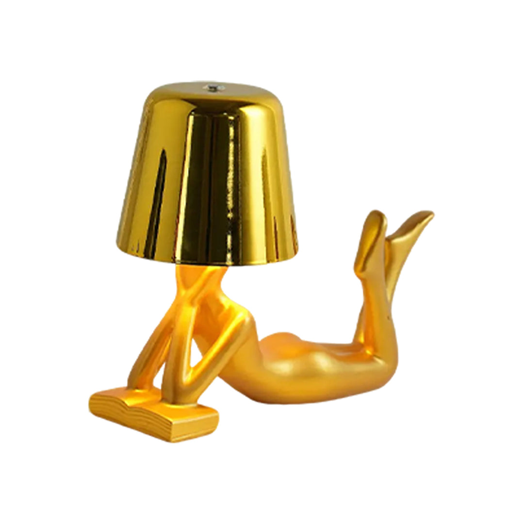 Modern table lamp with reclining figure shape