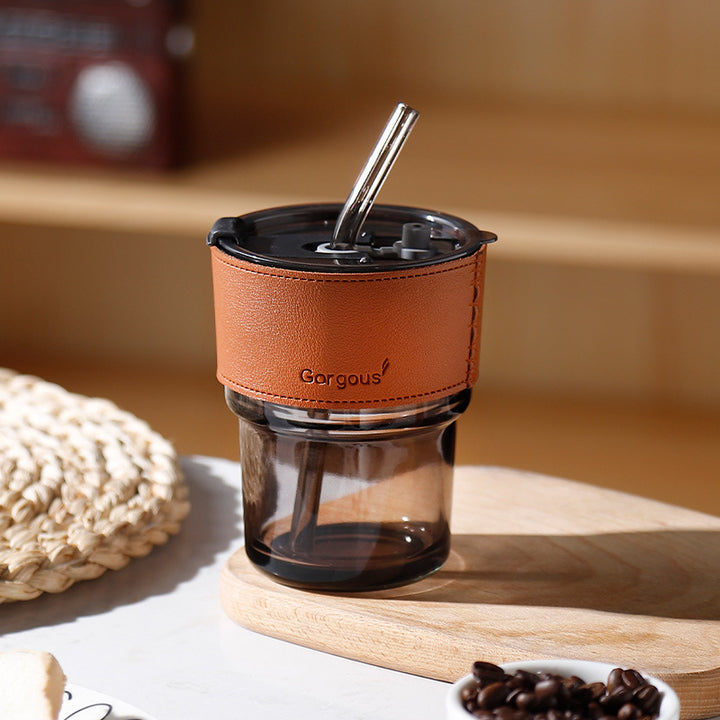 Glass drinking cup with straw