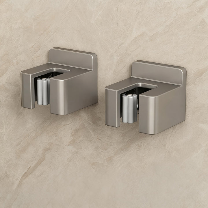 Stainless steel wall holder for brooms and mops