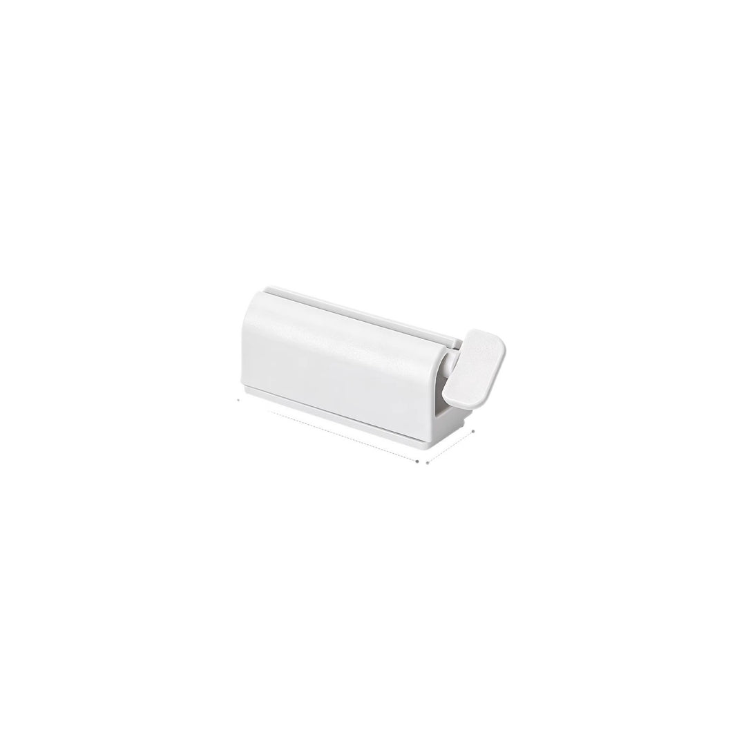 Magnetic toothpaste squeezer with holder